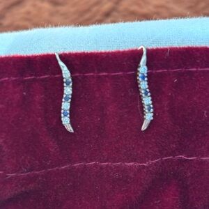 Riddles Jewelry sapphire and diamond ear crawler earrings. 14K white gold.